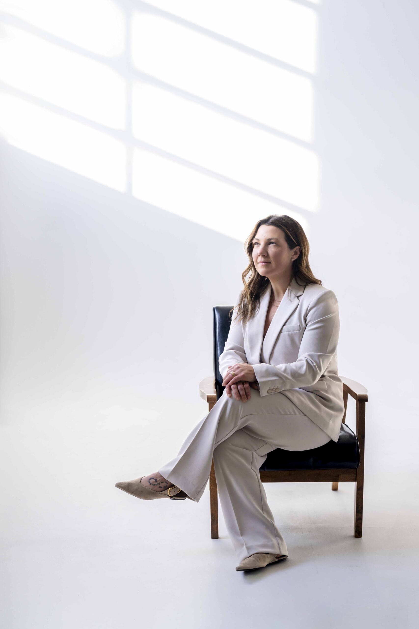 Boise branding photographer capturing a confident functional medicine business coach for Empowered Practice Collective during a studio branding session