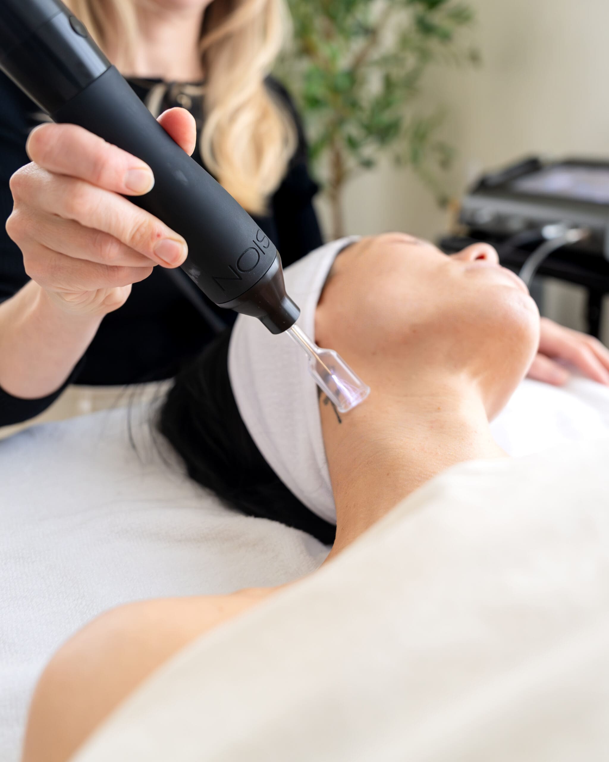 Boise branding photography session for aesthetic wellness clinic with client receiving plasma therapy