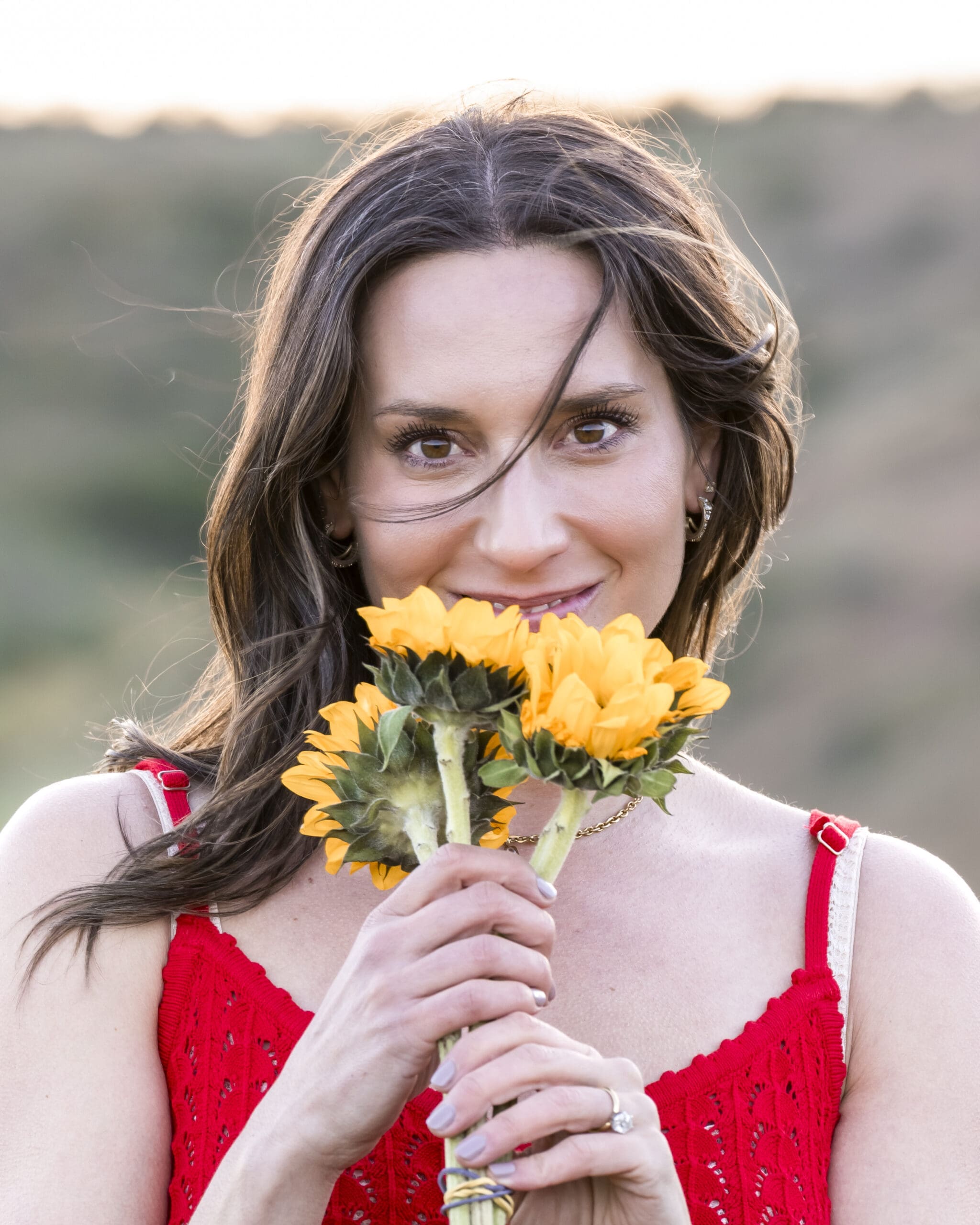 Outdoor branding portrait during golden hour in Boise foothills with wildflowers