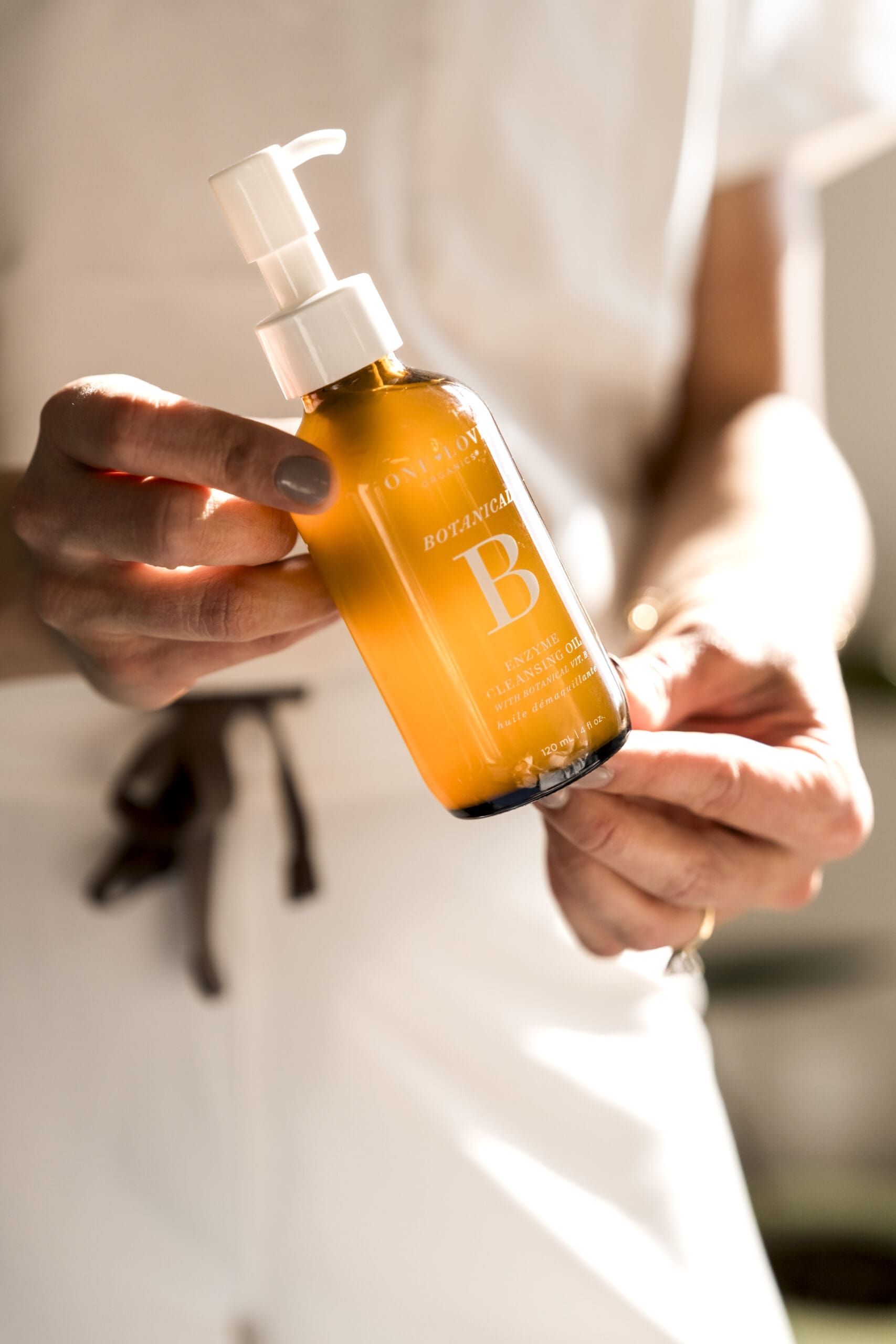 Close-up branding photo of skincare product in warm natural light for Boise medical aesthetics brand